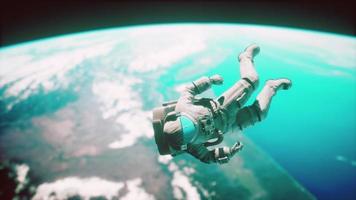 Astronaut floating above the Earth Elements of this image furnished by NASA