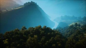 Sunset in mountain with green grass and trees video
