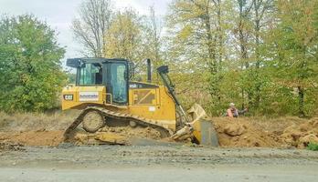 Ukraine, Kiev, October 1, 2019-Construction equipment and worker photo