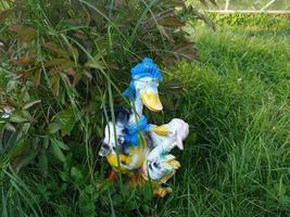 Decorative decoration in the form of a duck and duckling in our garden photo