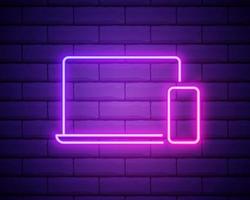 Neon light. Mobile devices sign icon. Notebook with smartphone symbol. Glowing graphic design. Brick wall. Vector