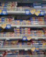 Blurred passage of a supermarket with shelves with goods. abstract passage in the supermarket with colorful goods on the shelves, can be used as a background or for your other project photo