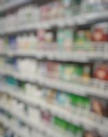 Blurred passage of a supermarket with shelves with goods. abstract passage in the supermarket with colorful goods on the shelves, can be used as a background or for your other project photo