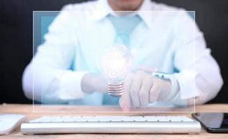Businessman using smartwatch and business icon virtual screen and internet data and Artificial intelligence technology in the future concept photo