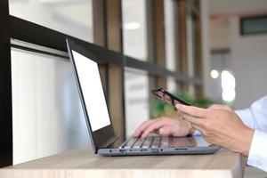 Businessman utilizing mobile smartphone and network connection photo