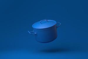 Blue Stainless steel pot floating in blue background. minimal concept idea creative. monochrome. 3D render. photo