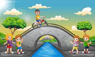 niños felices jugando en el puente vector