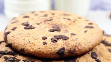 Soft, freshly baked chocolate chip cookies on a gray marble kitchen countertop. American traditional sweet pastry pastry, delicious homemade dessert. Culinary background. Close-up photo