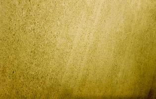 Gold background or texture and gradient shadow. wall and floor gold yellow mosaic tiles texture background. Metal texture background in gold.Panorama gold texture photo