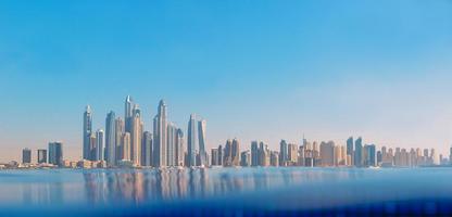 Cityscape of modern Dubai Marina with reflection in water. Travel concept photo