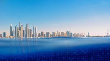 Cityscape of modern Dubai Marina with reflection in water. Travel concept photo