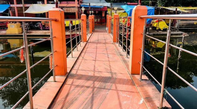 A Scenic view of an empty path of bridge at Chandrika Devi Temple photo