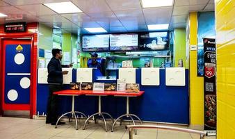 Domino's Pizza Restaurant. View of the rack and kitchen from the client table photo