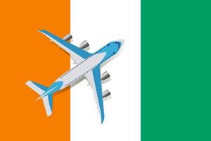 Vector Illustration of a passenger plane flying over the Ivory coast flag. Concept of tourism and travel