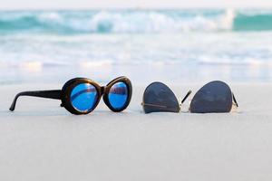 Sunglasses on sand beautiful summer beach photo