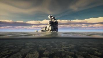 ocean seascape with sky and ocean wave splitted by waterline to underwater part photo