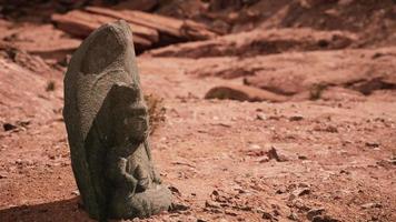 Ancient Statue on the Rocks Desert photo