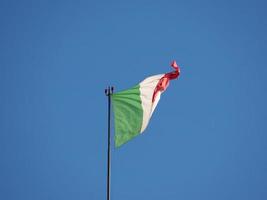 Italian Flag of Italy over blue sky photo