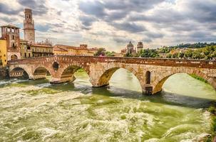 Ancient Roman Bridge called Ponte di Pietra in Verona, Italy photo