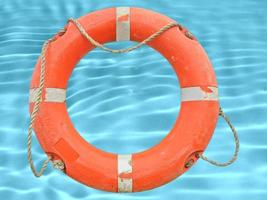 A lifebuoy over swimming pool water background photo