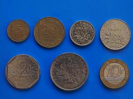 French Franc coins, France over blue photo