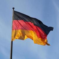 German flag over blue sky photo