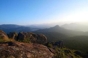 Sunset behind the hills photo