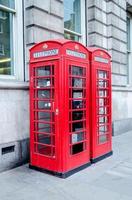 Traditional british red phone booth in London, UK photo