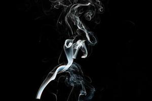 Smoke effect texture. Isolated background. Black and dark backdrop. Smokey fire and mistic effect.