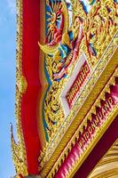 Colorful Wat Don Mueang Phra Arramluang buddhist temple Bangkok Thailand. photo