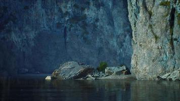 rocky cliffs in the ocean at sunny day video