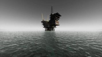 plate-forme pétrolière et navire offshore au coucher du soleil