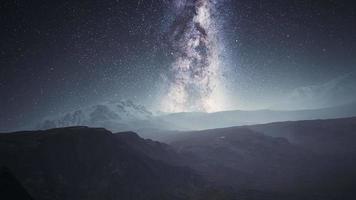 camera follow the Milky Way rotate in mountains video