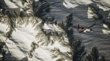 helicopter above mountains in snow video