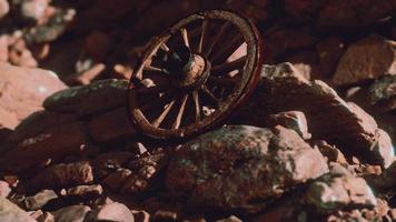 old wooden wheel on rocks video