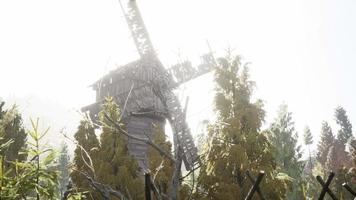 old traditional wooden windmill in the forest video