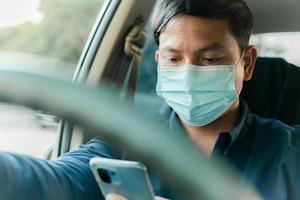 A man uses his phone while driving and falls asleep while driving. photo