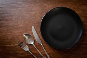 empty plate or dish with knife, fork and spoon photo