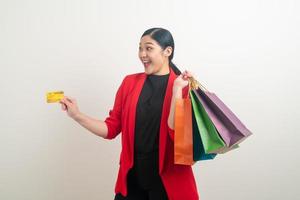 Asian woman holding shopping bag and credit card photo