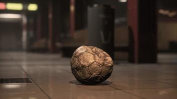 old soccer ball in empty subway video