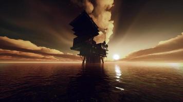 Aerial view offshore drilling rig at the offshore location during sunset video