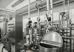 electronic control panel and tank at a milk factory. equipment at the dairy plant photo