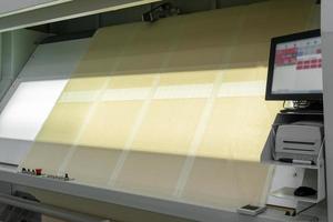 textile products and fabric in slides on lamp backlit screen photo