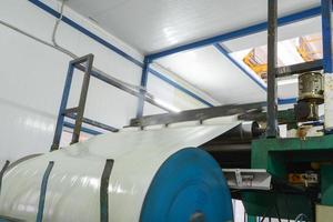 Press machine glues panel. Plant for the production of sandwich panels from styrofoam photo