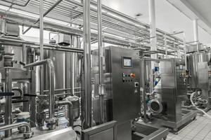 electronic control panel and tank at a milk factory. equipment at the dairy plant photo