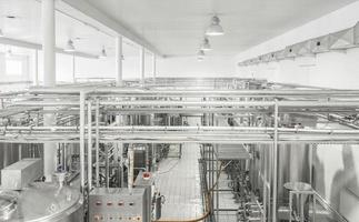 general view of the interior of a milk factory. equipment at the dairy plant photo