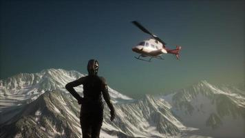 woman and helicopter in winter mountains video