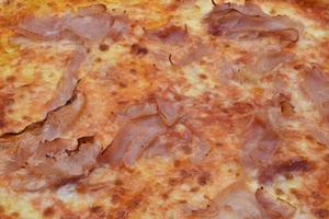 Italian Ham and Mozzarella cheese Pizza background. photo