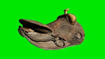 Vintage Horse Saddle on green chromakey background video