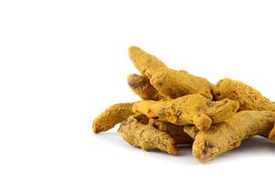 Dry Turmeric roots or barks isolated on white background photo